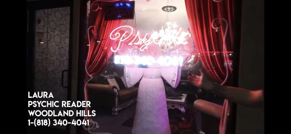 Psychic reading room with neon sign at Laura Psychic Reader in Woodland Hills, CA